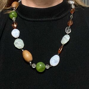 Vintage necklace with wood,stone and plastic beads.Clasp closure. 24” to…